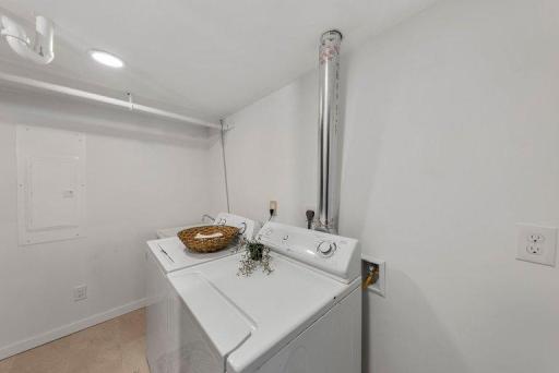 Dedicated laundry area provides convenient functionality with space for everyday household needs.