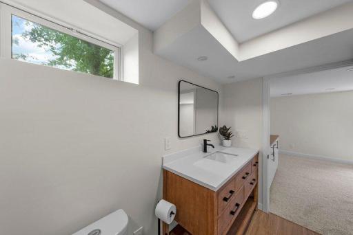 Updated vanity area combines modern style with practical storage and functionality.