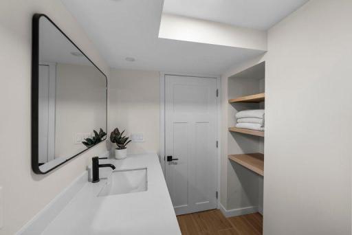 Durable, easy-care flooring complements the bathroom's updated contemporary finishes.