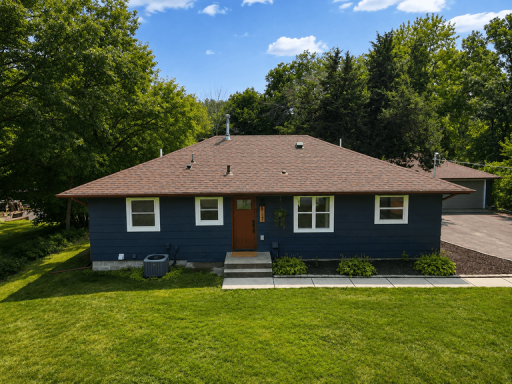 Photo for 8124 Mount Curve Boulevard, Brooklyn Park, MN 55445 - listing #7127730 Completely remodeled home featuring a fresh, contemporary exterior, new driveway, professional landscaping, and a welcoming approach.