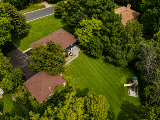 Spacious 0.9-acre lot surrounded by mature trees and privacy.