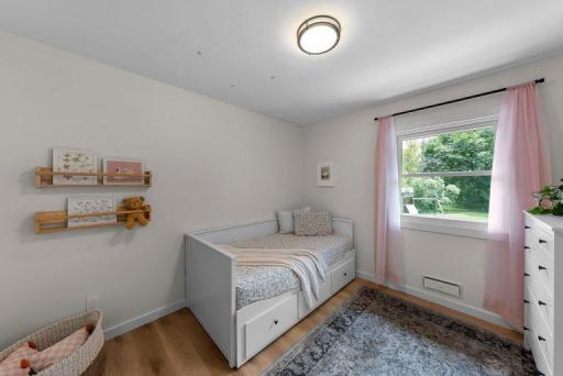Freshly remodeled bedroom offers a comfortable retreat with a neutral palette and contemporary details.