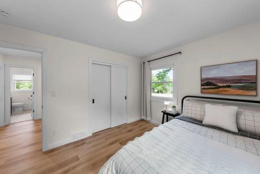 Generously sized bedroom featuring updated finishes and luxury vinyl plank flooring.
