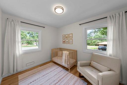 Large windows bring in natural light while overlooking the established neighborhood surroundings.