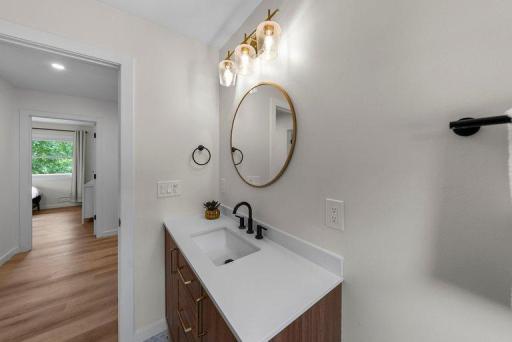 Carefully selected finishes and updated fixtures give this bathroom a fresh, polished appearance.