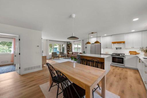 Open-concept design creates seamless flow between the living, dining, and kitchen areas—ideal for both everyday living and entertaining.