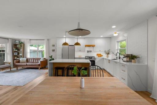Open kitchen and dining area create an inviting gathering space with excellent flow and natural connectivity to the main living area.