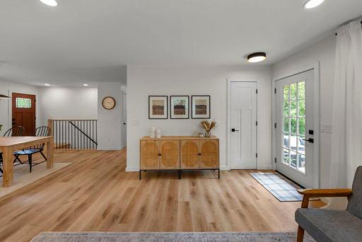Bright, open living space with a thoughtfully designed layout, contemporary finishes, updated lighting, and luxury vinyl plank flooring.