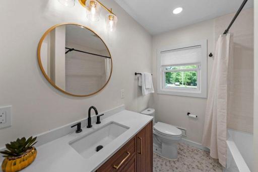 Completely remodeled bathroom featuring contemporary finishes, updated fixtures, and a fresh modern design.