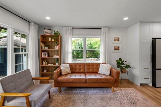 Large windows provide abundant natural light and peaceful backyard views.