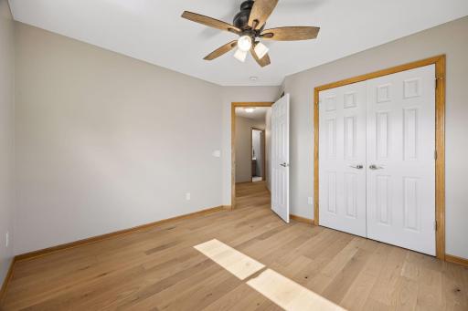 The upper level bedroom. There are a total of four - one being the primary bedroom. These rooms have all been freshly painted with a beautiful neutral color.