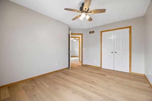 The upper level bedroom. There are a total of four - one being the primary bedroom. These rooms have all been freshly painted with a beautiful neutral color.
