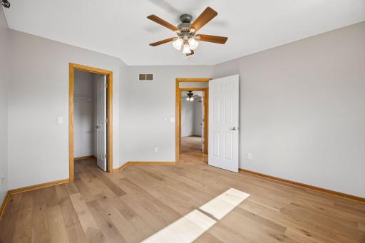 The upper level bedroom. There are a total of four - one being the primary bedroom. These rooms have all been freshly painted with a beautiful neutral color.