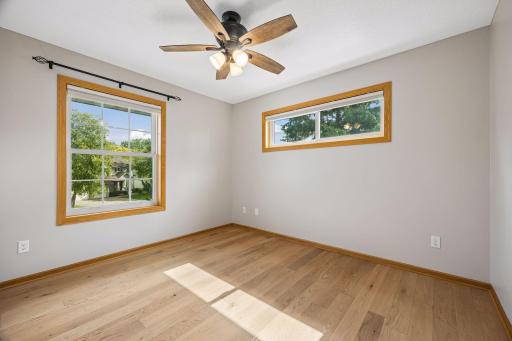The upper level bedroom. There are a total of four - one being the primary bedroom. These rooms have all been freshly painted with a beautiful neutral color.
