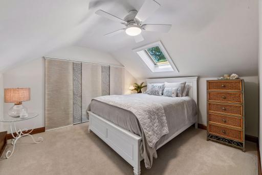 Sunlight ours in this bedroom with perfectly positioned skylight with electronic blinds.