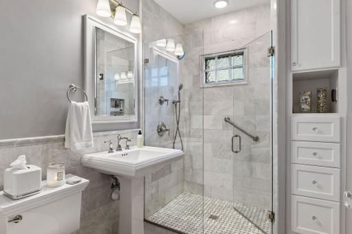 Stunning new bathroom with walk-in shower and custom built in cabinets