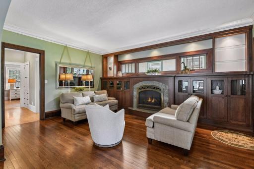 Rich details - custom built-ins - stunning gas fireplace and gleaming hardwood floors