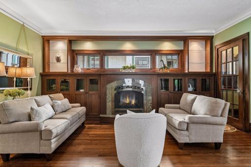 Rich details - custom built-ins - stunning gas fireplace and gleaming hardwood floors