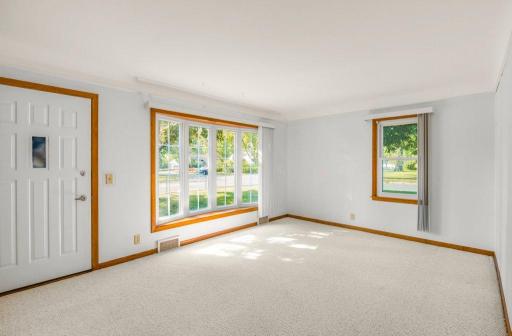 Main level living room with a beautiful bay window!