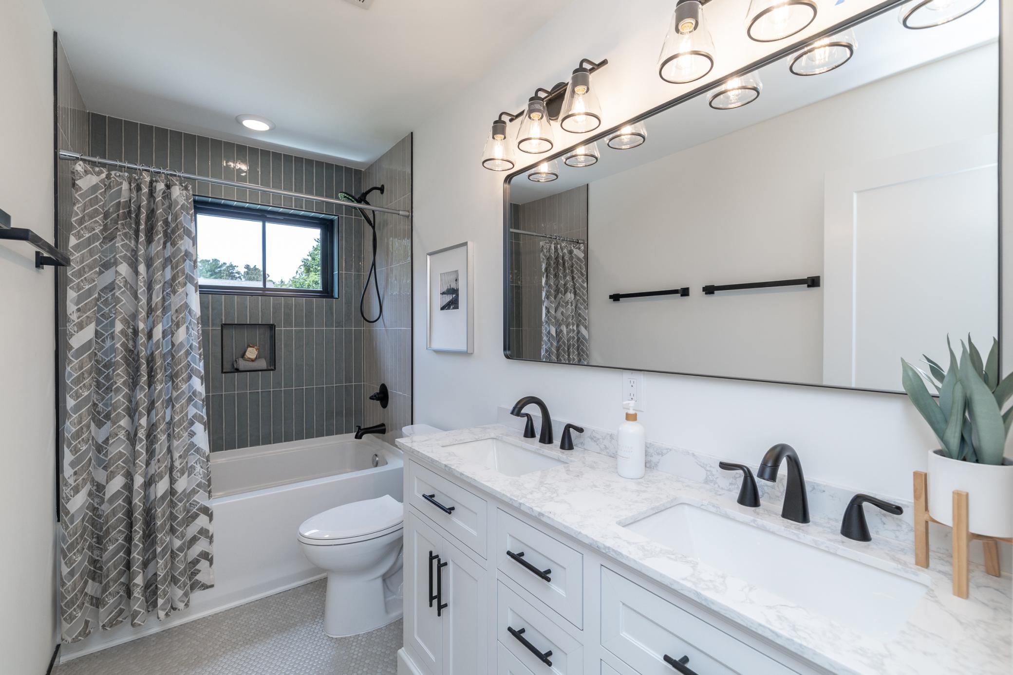 Upper level full bath with double sinks, and beautiful ceramic walls and floor