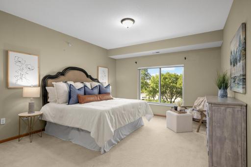 The primary bedroom includes a spacious walk-in closet and in-unit laundry.