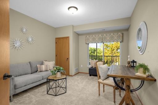 The 2nd bedroom has brand-new carpet and provides flexibility as a guest room, home office, or hobby space.