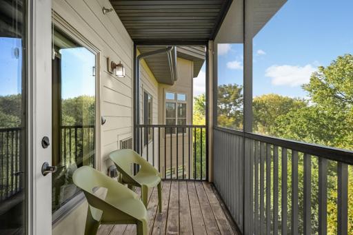 From the living area, step onto the private screened deck, a comfortable spot to enjoy the outdoors while taking in the views of the creek.