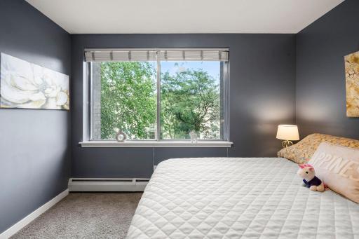 Bedroom faces a unique 29' greenspace