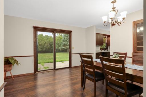 The dining area opens directly to the backyard through the new patio door—perfect for summer grilling and easy indoor-outdoor entertaining.