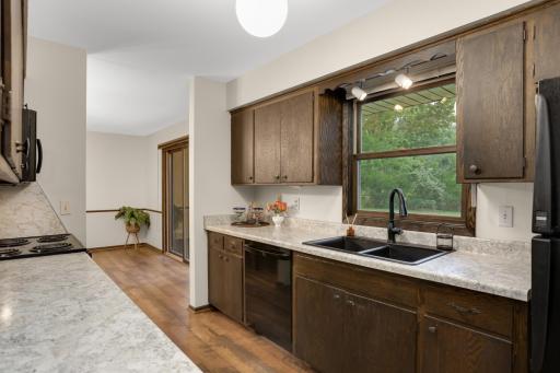 Thoughtful updates include refreshed countertops, a new sink and faucet, plus a window overlooking the backyard.