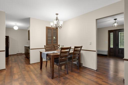 A comfortable dining space conveniently positioned between the kitchen, living areas and backyard.