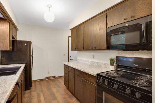 Ample cabinetry and counter space provide plenty of everyday function, with updated countertops giving the space a freshened-up look.