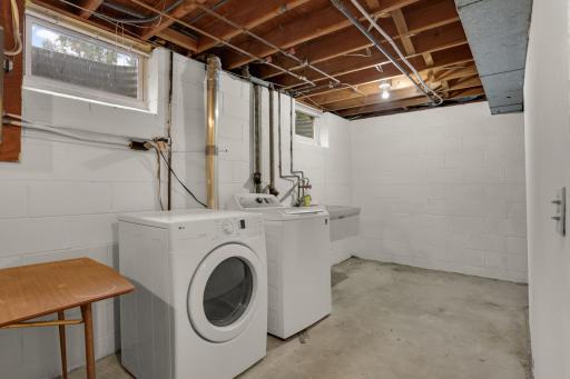Convenient lower-level laundry with plenty of additional space for storage and everyday household needs.