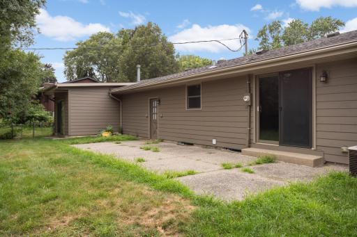 Step outside through the new patio door to a backyard patio ready for grilling, outdoor dining and summer evenings