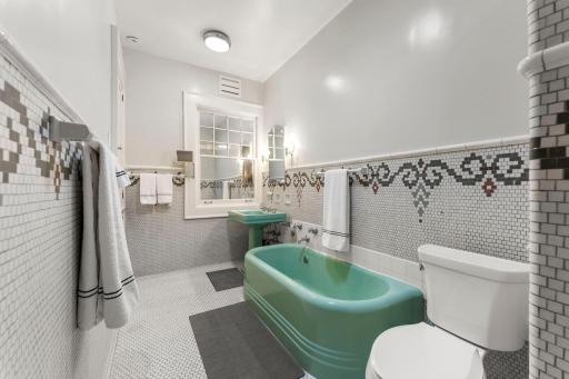 Main bath has soaking tub and separate shower