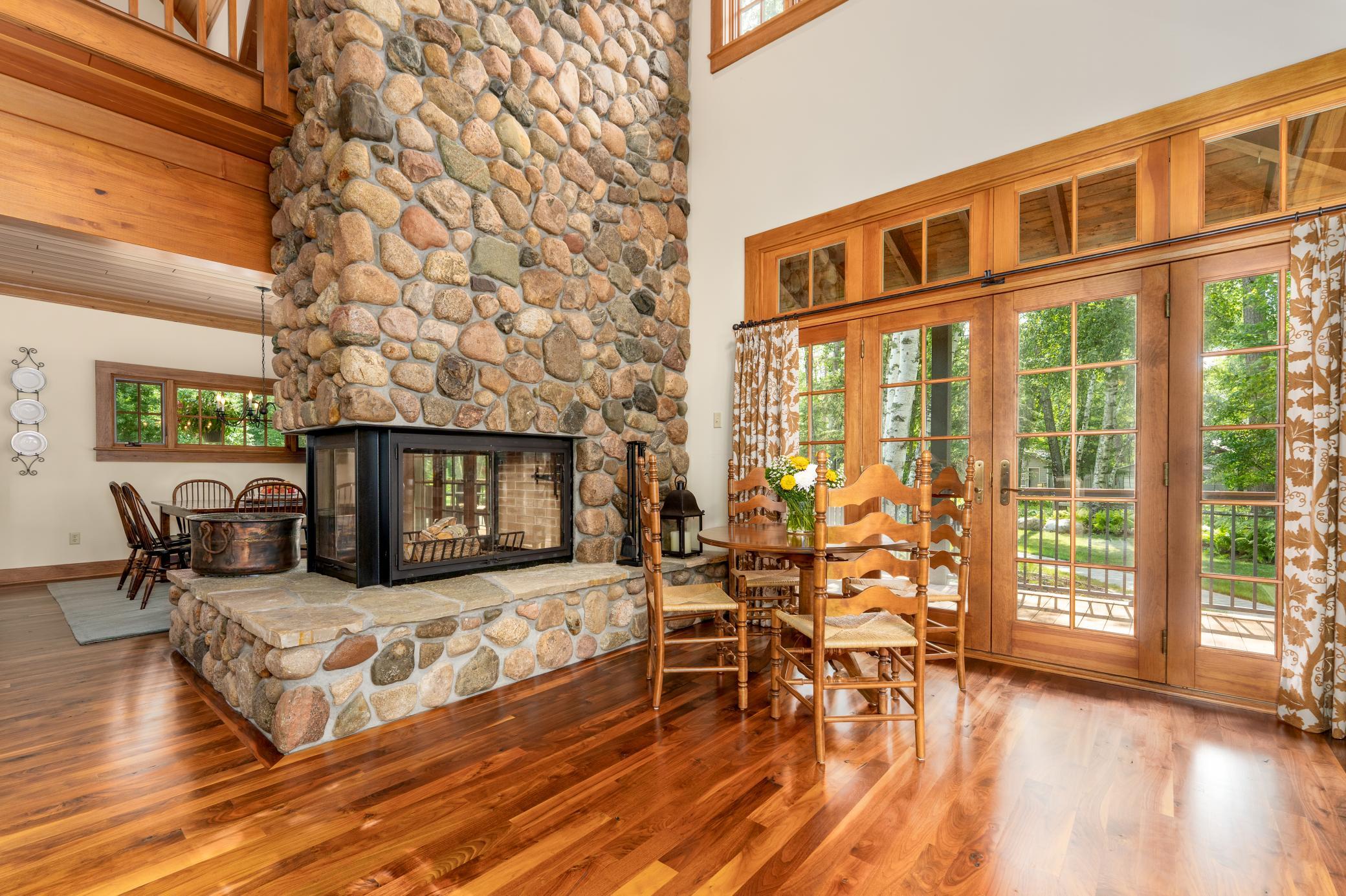 Grand floor to ceiling stone/wood fireplace!
