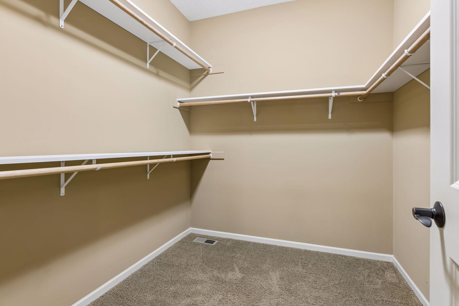 Large primary walk-in closet.