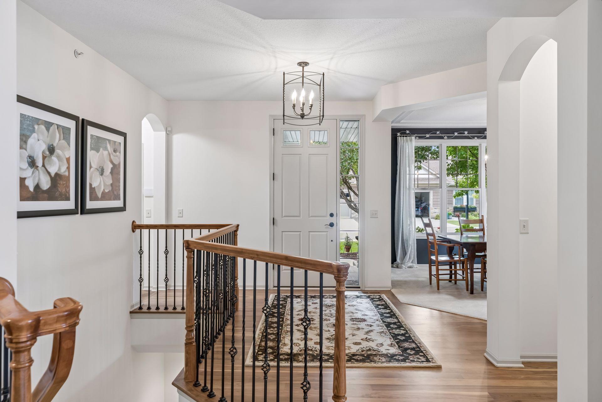 Gracious foyer entry with newly installed natural hardwood flooring.