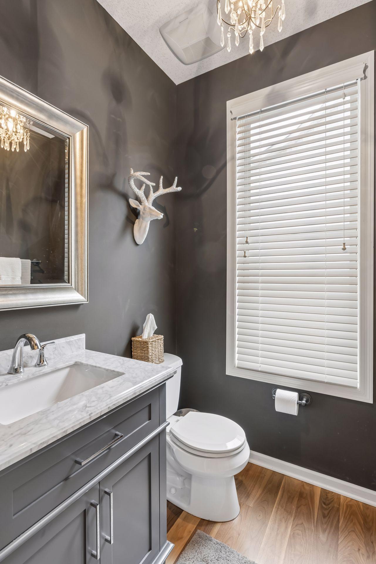 Tasteful guest main floor powder room.
