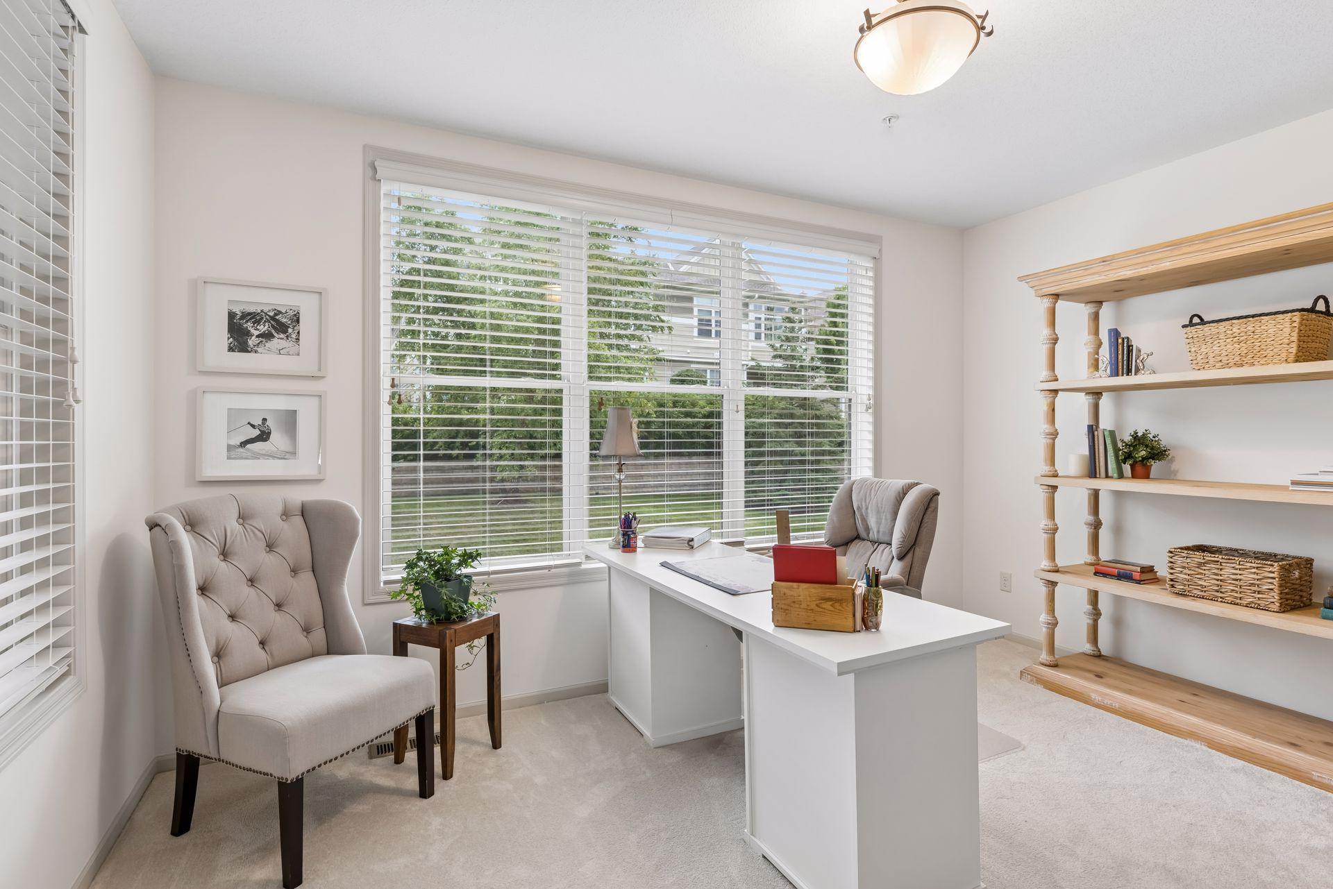 The charming sunroom is a true bonus and offers lovely views of the backyard from the wall of windows.