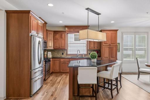 Newly installed natural hardwood floors offer a timeless finish to this exceptional space.