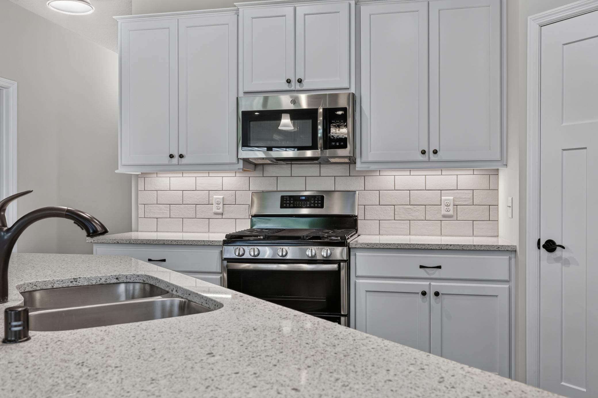 Stone Countertops and Tile Backsplash