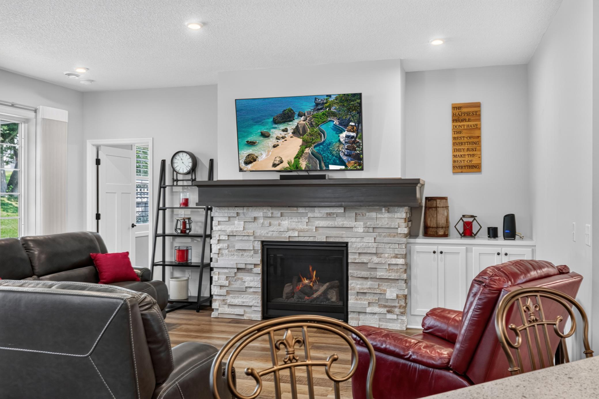 Stone Gas Fireplace with Mantle and Built In Cabinet
