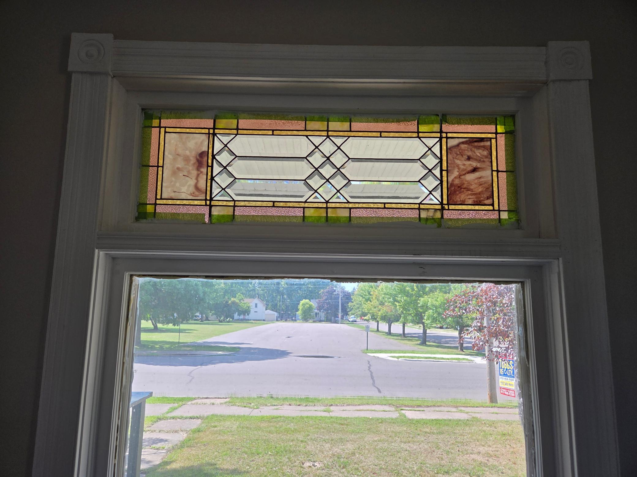 front window with leaded stain glass and accents