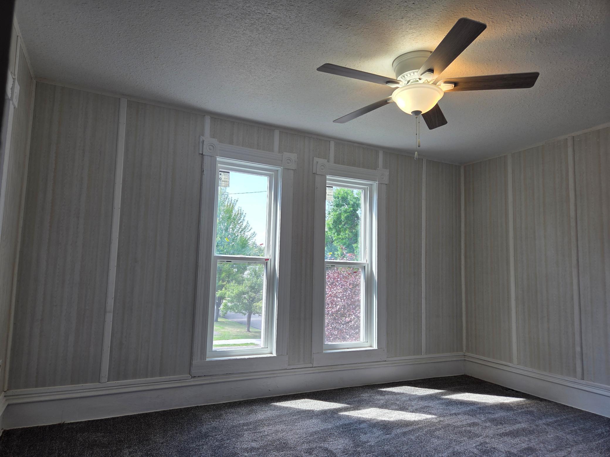 primary bedroom with ceiling fan