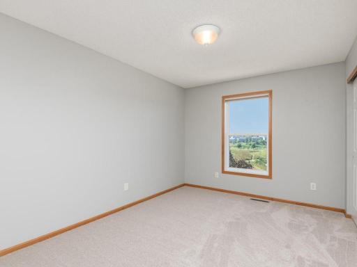 The first of three additional junior bedrooms on the upper level.