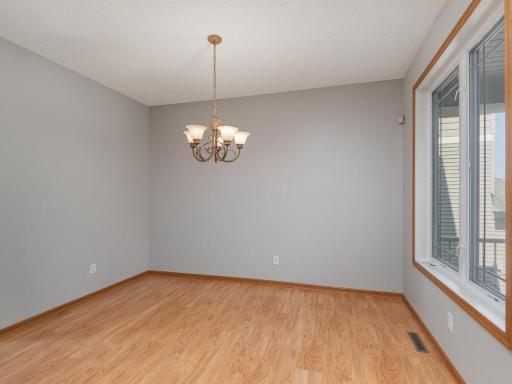 A generous flex space in the front of the home overlooking the porch & front paver patio.