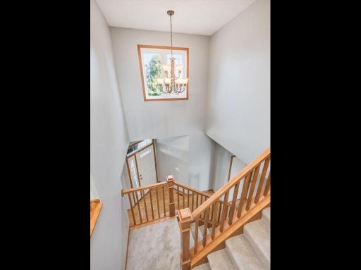 The two story entry is filled with natural light & the open staircase is an impressive architectural detail.