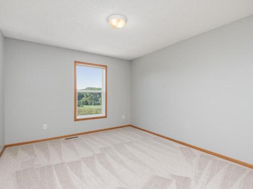 Second of three junior bedrooms on the upper level.
