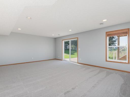 Wonderful finished walkout lower level is ideal for amusement room with space for movie nights & plenty of room for gaming tables, crafts, or billiards.